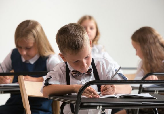 School children in classroom at lesson