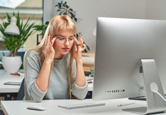 Woman feels tired while working in the office